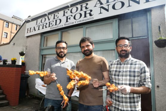 Adeel Ahmad Malih , Fawad Baloch and Adnan Shahzad prepare the food.