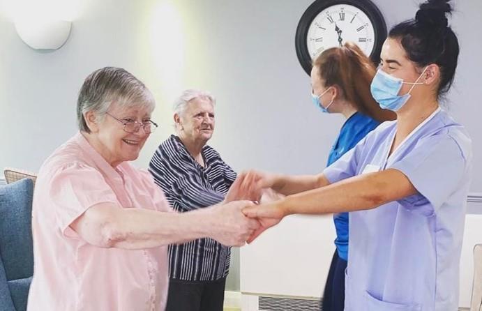 carers dancing with residents 